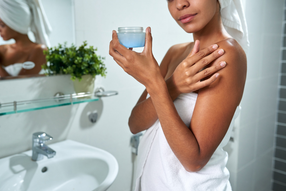 After you get out of the shower, pat your skin dry and apply a moisturizer or lotion to your entire body.